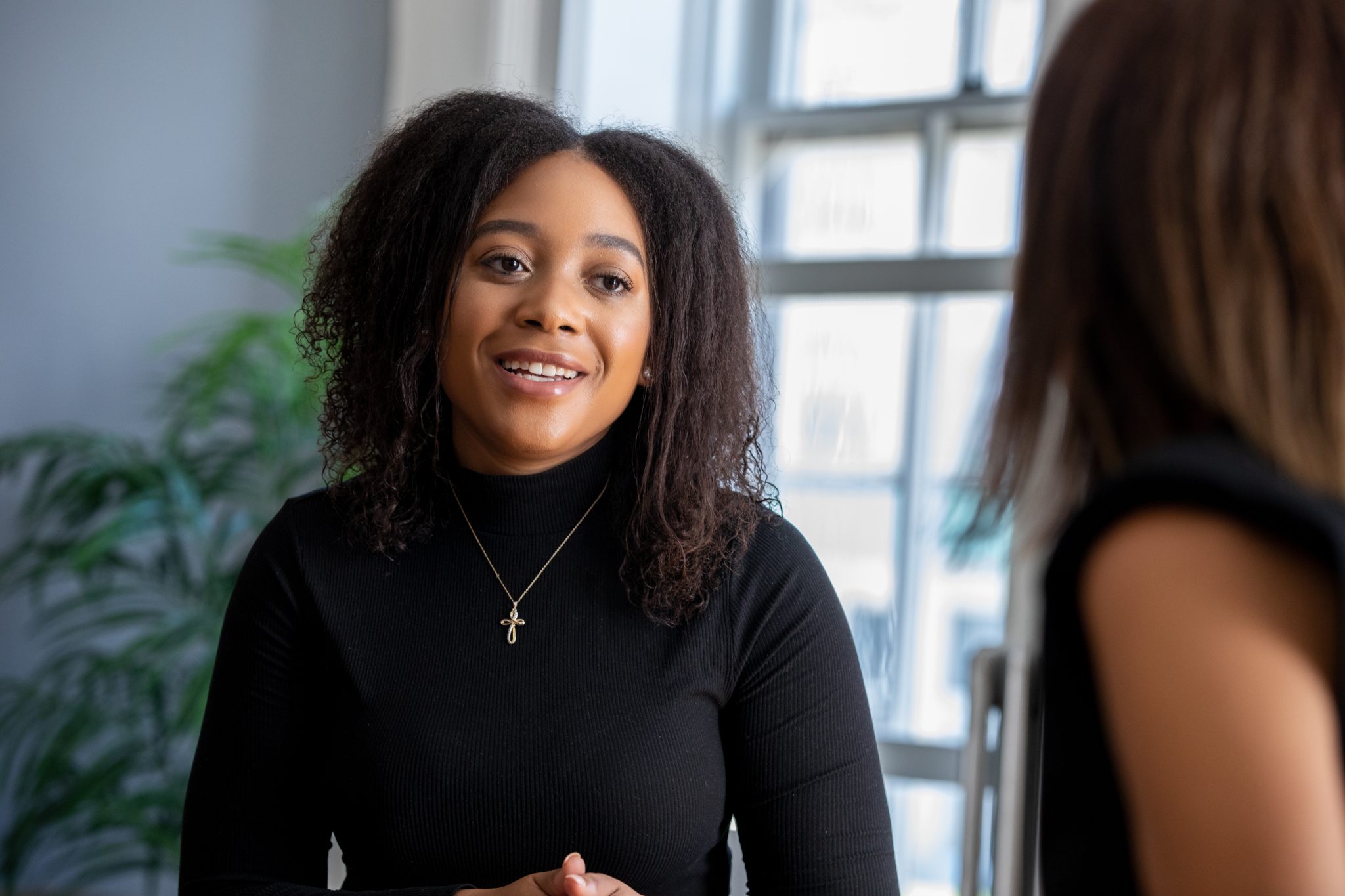 Millennial Woman talking to university advisor