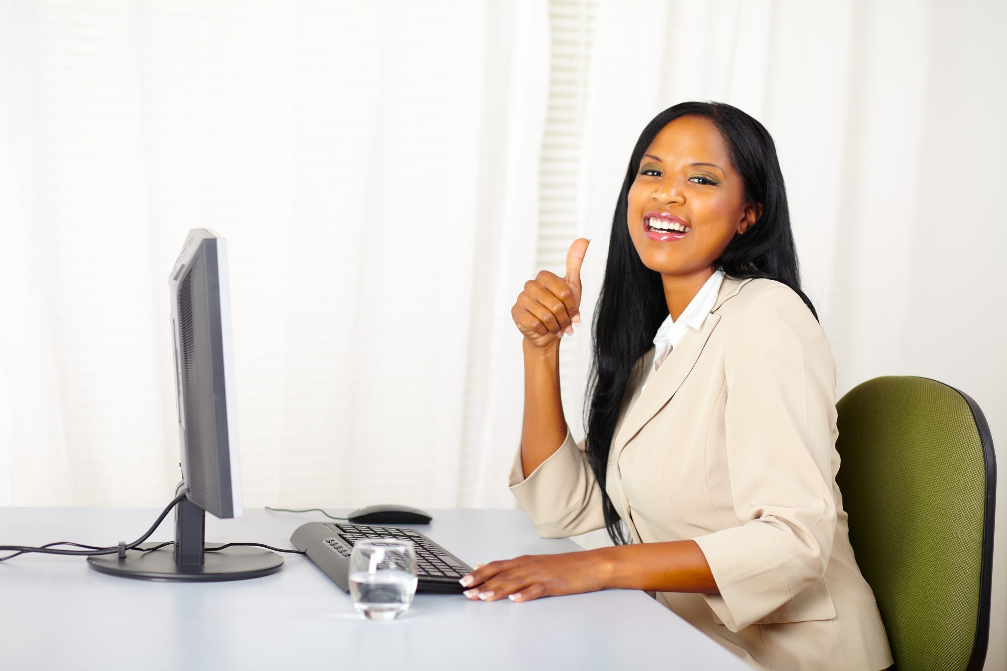 Portrait of a successful executive female at work while lift a finger up and laughing to you